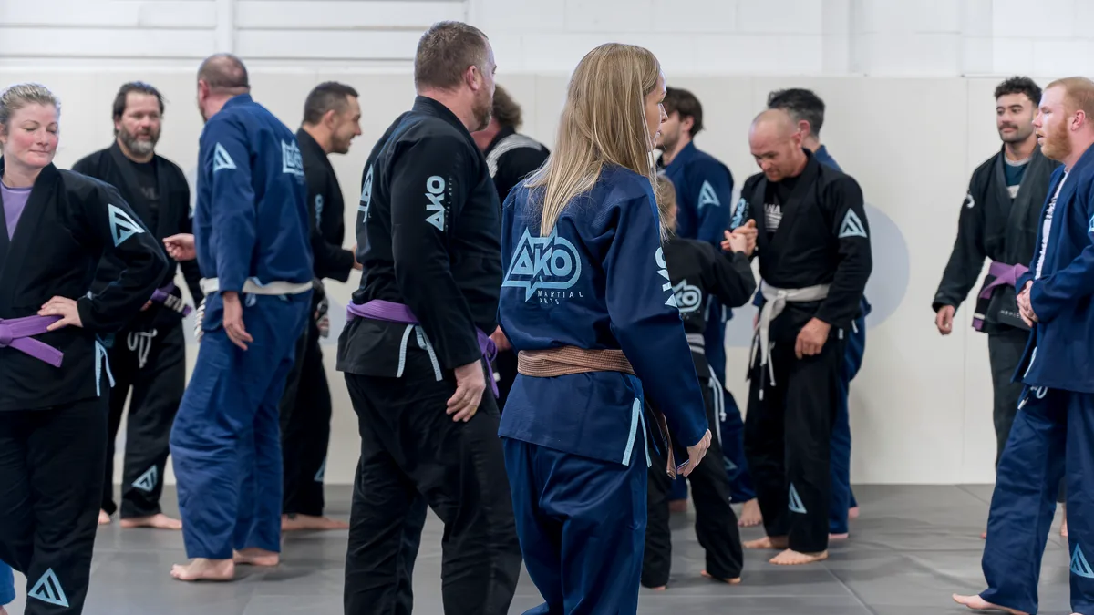 An adult class at Ako Martial Arts — women and men training together on the mats